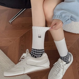 Retro black and white checkered mid-calf socks featuring cute cat embroidery for women