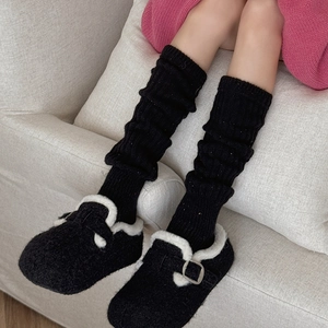 Winter plush slippers with white faux fur trim and matching black knit leg warmers