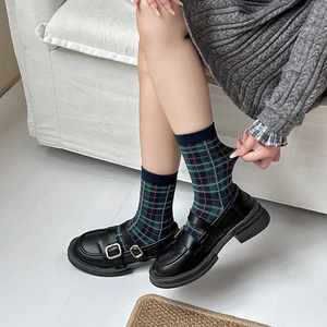 British style plaid cotton crew socks in green and red paired with Mary Jane platform shoes