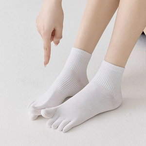Detailed macro view of white cotton five-finger socks with ribbed cuffs and breathable mesh