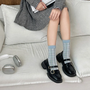 British style blue-grey plaid crew socks paired with black Mary Jane buckle shoes