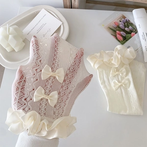 Detail of milk white lace socks with bow ties and breathable mesh hollow-out knit
