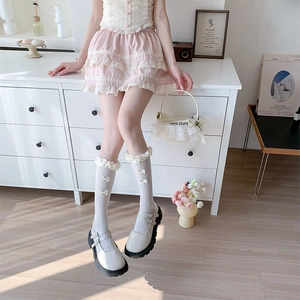 White Lolita lace socks with bow detail and mesh design for a sweet Japanese style look