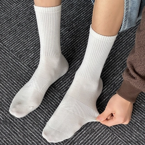 White crew socks for men with ribbed cuffs and breathable mesh in high stretch cotton