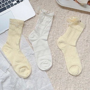 Three-pack sweet ballet style bow socks with lace trim in cream yellow and white colors