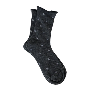 Deep grey mid-calf socks with white bow jacquard patterns and roll-edge cuffs