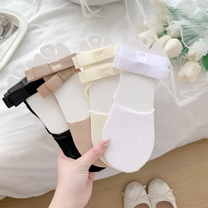 Detail of breathable low cut liner socks with elegant ribbon bow in various colors