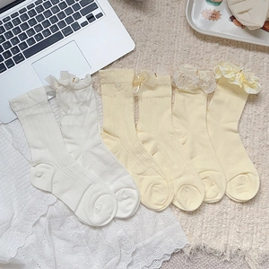Set of 6 pairs of ballet style cream yellow socks with lace trim and bows for women