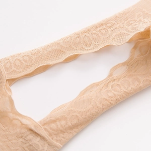 Detail of floral lace mesh and scalloped edges on breathable nude invisible boat socks