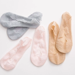 Detailed lace texture of breathable low-cut invisible socks in grey, pink, and beige colors