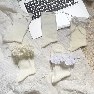 White Lolita lace socks with bows, featuring hollow-out mesh and ruffle ballet style