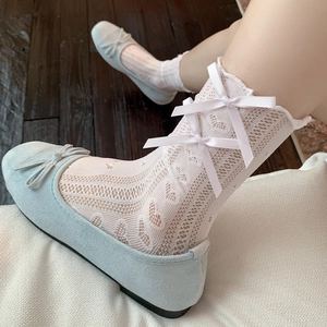 Pink Lolita style lace crew socks with hollow heart patterns and satin bows