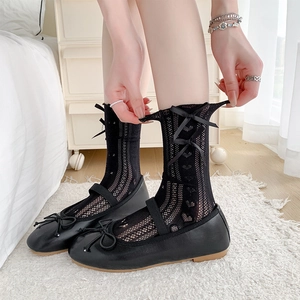Sweet Lolita style black lace mesh socks with bows paired with Mary Jane flats