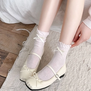 Bow ruffled mid-tube socks with Mary Jane shoes shown from a 45-degree angle