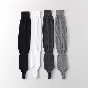 Breathable ballet style stirrup leg warmers in black, white, and grey knitted fabric