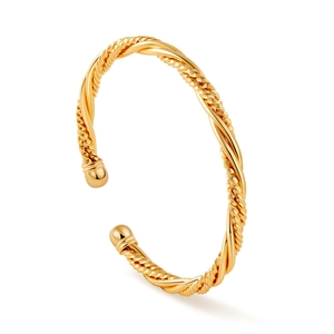 Bracelet jonc torsadé doré poli avec extrémités sphériques sur fond blanc pur