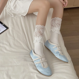 French style white lolita calf socks with elegant lace trim paired with blue satin flats