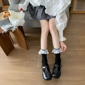 Detail of ballet style socks with lace ruffles and bowknot in multiple colors