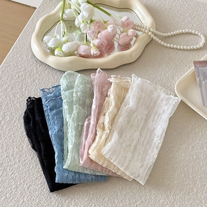 Macro detail of lace flower mesh socks in six pastel colors for summer breathability