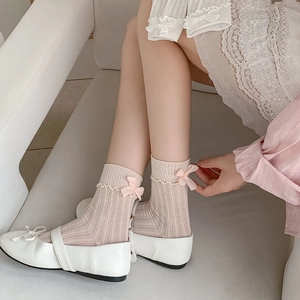 Beige ribbed crew socks with back bow and ruffle trim for sweet Lolita fashion style