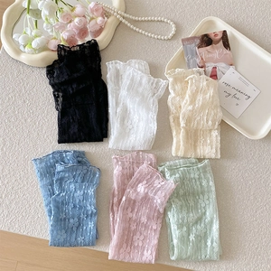 Flat lay of floral lace socks in six pastel colors featuring delicate mesh embroidery