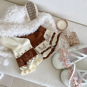 Detail of vintage bow socks, rabbit ear hat and Mary Jane shoes in a sweet aesthetic set