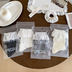 Lace ruffle trim socks set in black white grey and beige shown in gift packaging