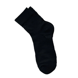 Minimalist black knitted crew socks for women featuring breathable cotton fabric