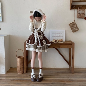 Detail of sweet lace calf socks with brown cherry bow accents and retro leather shoes