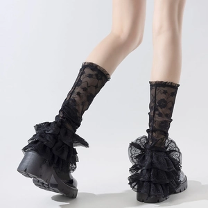 Detailed view of black tiered lace leg warmers featuring intricate floral patterns