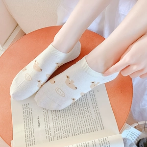 Women's white low-cut boat socks with cute brown bear patterns and CUTE text embroidery