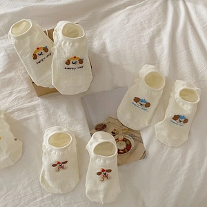 Detail of white cotton low-cut liner socks featuring cute dog embroidery and Happy Day text