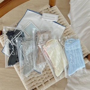 Detailed view of five-pair breathable bow socks set in individual zipper pouches