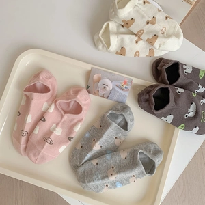 Detail of four pairs of breathable low-cut boat socks with cute cartoon animal prints