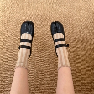 Women's black leather Tabi Mary Jane shoes with double buckle straps and split toe design
