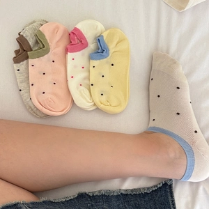 Close-up of cute polka dot cotton boat socks with breathable mesh for women