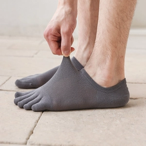 Detailed shot of breathable mesh texture and stretch of men's five-finger low-cut socks