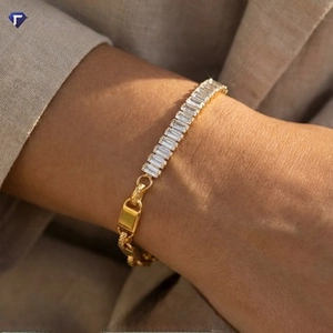 Detail of elegant 18K gold plated chain bracelet with rectangular sparkling zircon stones
