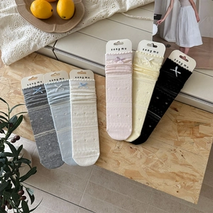 Detailed display of six-color hollow lace socks with bow ties and original packaging