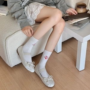 White crew socks with heart embroidery and Life is a journey text with ballet flats