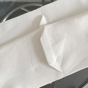 Close-up of white vertical ribbed knit fabric texture and elastic weave density for socks