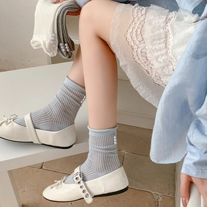 Ballet style light blue ribbed mid-calf socks with side pearl accents and rolled edges