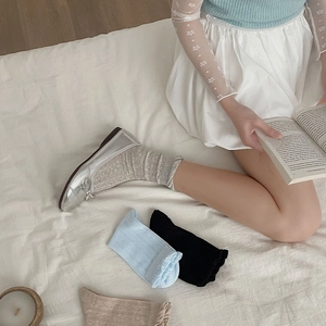 Detailed close-up of diamond pattern hollow mesh socks in soft pastel cotton blend