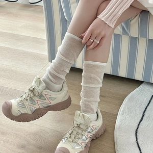 Chunky beige platform sneakers with pink accents and durable brown non-slip rubber soles