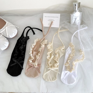 Close-up of ballet lace boat socks in four colors with long ankle ribbon ties