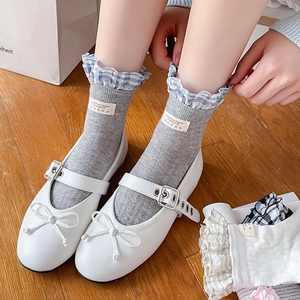 Ballet style grey ruffle socks with blue plaid trim and white Mary Jane shoes