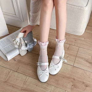 Detail of ballet style lace trim socks in multiple colors with plaid texture and ribbon label