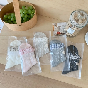 Detailed view of five-pair women's ballet-style crew socks set in various colors with lace