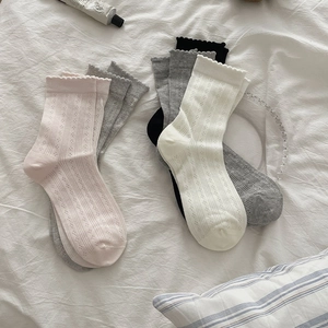 Detail of sweet pointelle mesh socks with lace trim in pink, white, gray, and black colors