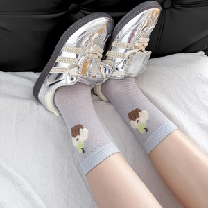 Detail of breathable light purple mesh sock with cute ice cream embroidery and soft fabric